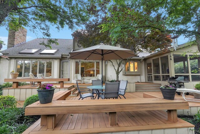 7661 Norhill Rd, Columbus, OH 43235 - wooden terrace with a sunroom, outdoor dining space, and a grill
