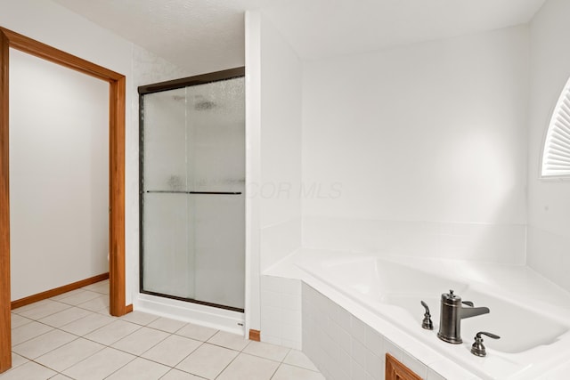 1296 Blacksmith Dr, Westerville, OH 43081 - bathroom with a shower stall, a garden tub, and tile patterned flooring