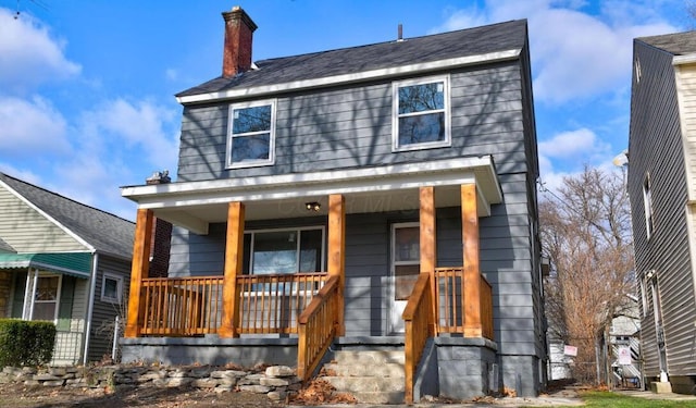 798 E Mithoff St, Columbus, OH 43206 - view of front of home with covered porch and a chimney