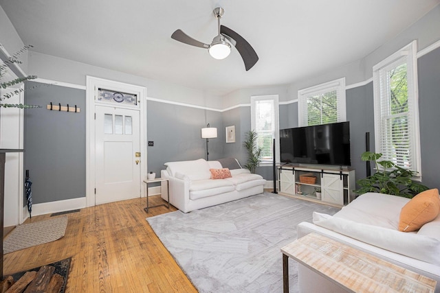 1066 City Park Ave, Columbus, OH 43206 - living area with a ceiling fan, wood finished floors, and healthy amount of natural light