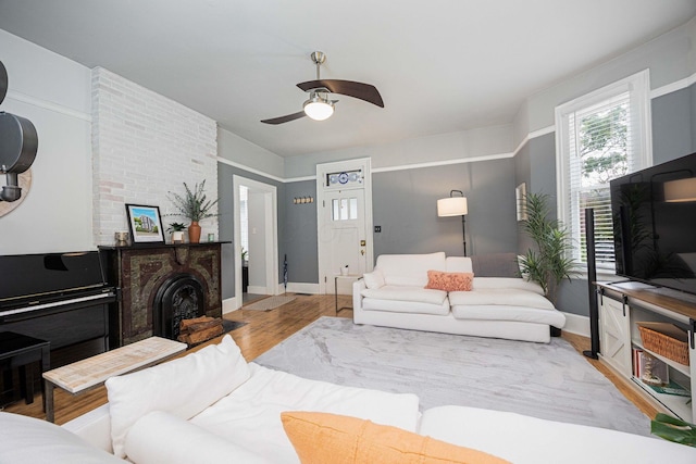 1066 City Park Ave, Columbus, OH 43206 - living room featuring ceiling fan and wood finished floors