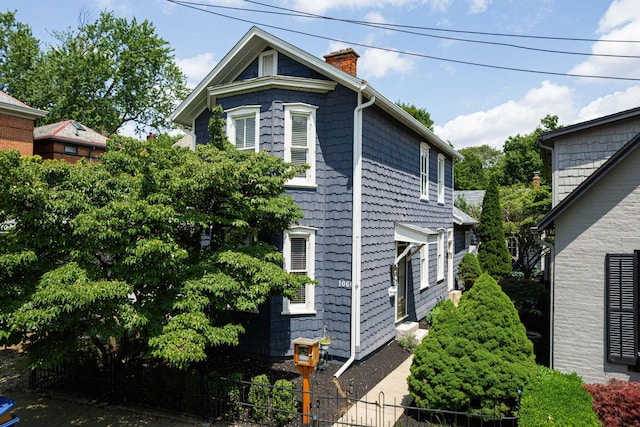 1066 City Park Ave, Columbus, OH 43206 - view of home's exterior with a chimney
