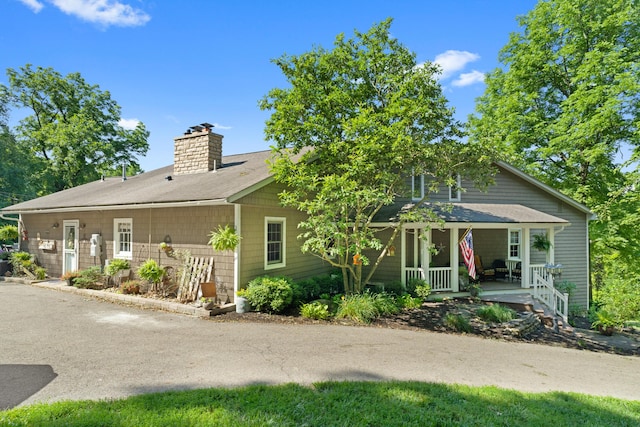 170 Joy Ln, Granville, OH 43023 - view of front of property with a chimney, covered porch, and a shingled roof