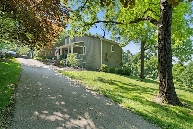170 Joy Ln, Granville, OH 43023 - view of side of home with a porch, a yard, and driveway