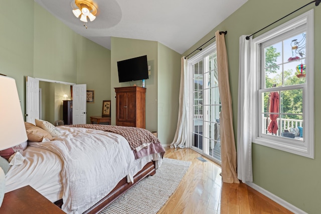 170 Joy Ln, Granville, OH 43023 - bedroom featuring vaulted ceiling, access to outside, light wood-style floors, and a ceiling fan