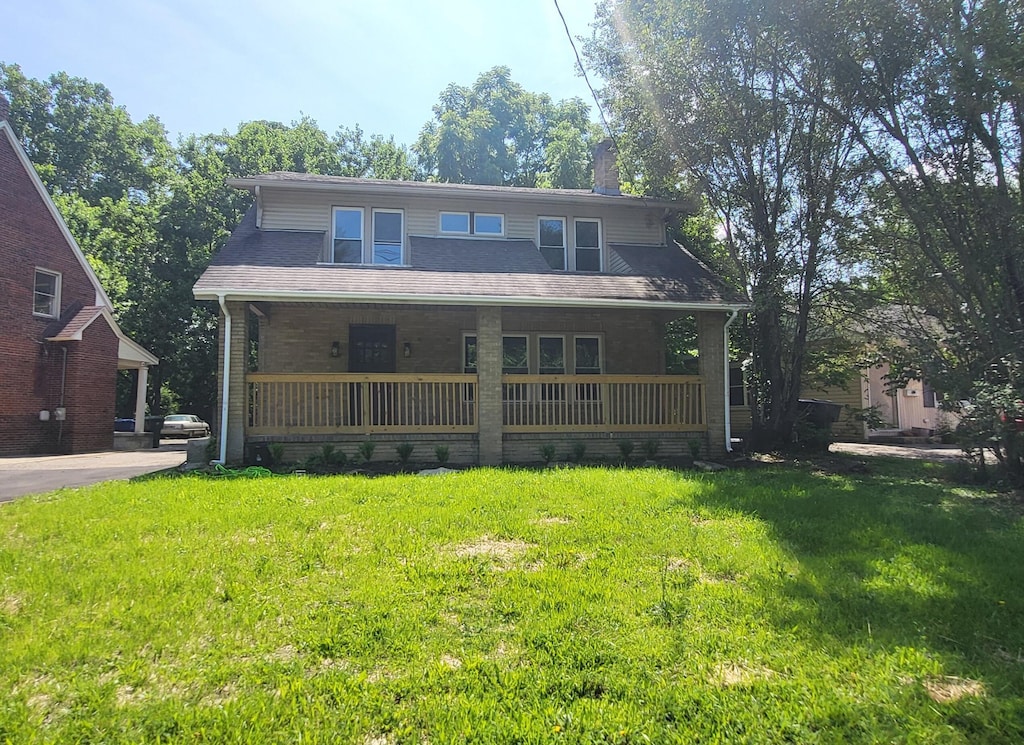 984 N Nelson Rd, Columbus, OH 43219 - back of property featuring covered porch and a lawn