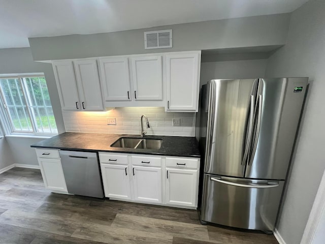 965 Francis Ave, Columbus, OH 43209 - kitchen with stainless steel appliances, dark countertops, and white cabinetry