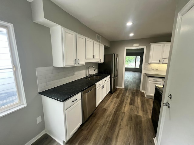 965 Francis Ave, Columbus, OH 43209 - kitchen featuring stainless steel appliances, dark wood finished floors, white cabinets, backsplash, and recessed lighting