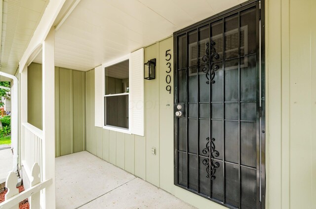 5309 Sundale Pl S, Columbus, OH 43232 - doorway to property with covered porch and board and batten siding