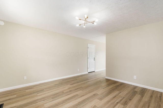 5309 Sundale Pl S, Columbus, OH 43232 - spare room with a chandelier and light wood-type flooring