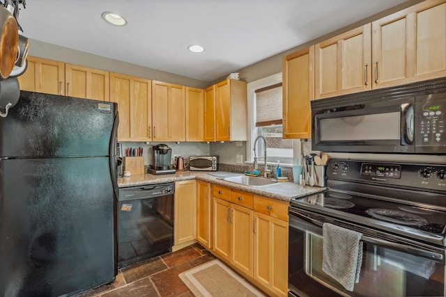 2350 Indiana Ave, Columbus, OH 43202 - kitchen featuring black appliances, light brown cabinetry, stone tile floors, recessed lighting, and light countertops