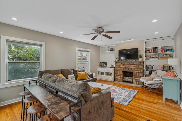 2350 Indiana Ave, Columbus, OH 43202 - living room with plenty of natural light, light wood-type flooring, a ceiling fan, a fireplace, and recessed lighting