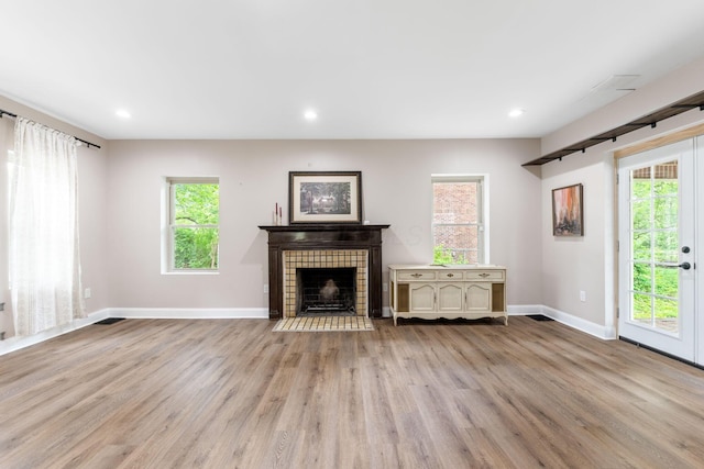 992 N Nelson Rd, Columbus, OH 43219 - unfurnished living room featuring wood finished floors, a fireplace, and recessed lighting