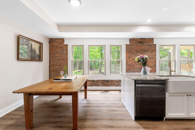 992 N Nelson Rd, Columbus, OH 43219 - dining space featuring plenty of natural light, light wood-style floors, brick wall, and recessed lighting