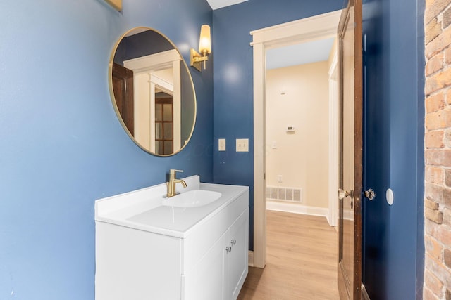 992 N Nelson Rd, Columbus, OH 43219 - bathroom featuring wood finished floors and vanity