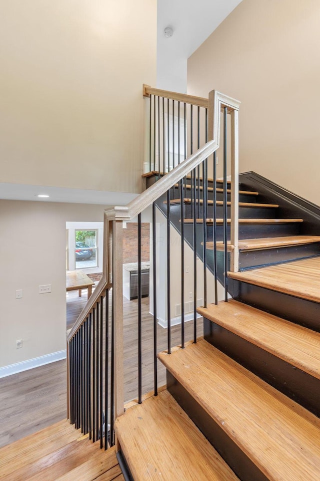 992 N Nelson Rd, Columbus, OH 43219 - stairs with wood finished floors and a high ceiling