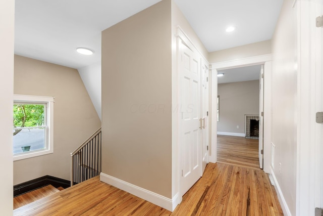 992 N Nelson Rd, Columbus, OH 43219 - hallway featuring light wood-type flooring, an upstairs landing, and recessed lighting