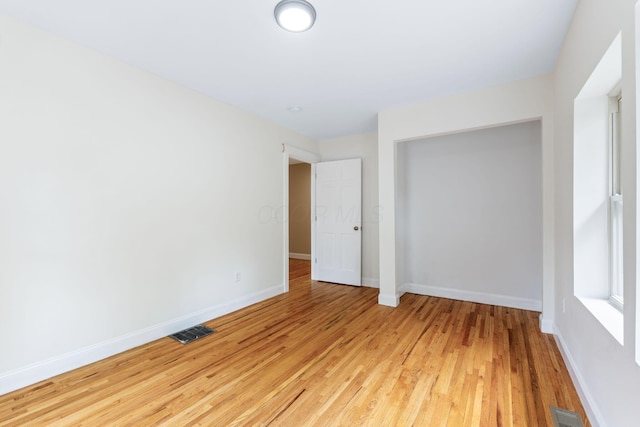 992 N Nelson Rd, Columbus, OH 43219 - empty room with light wood-style flooring and baseboards