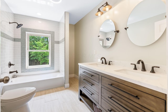 992 N Nelson Rd, Columbus, OH 43219 - bathroom with double vanity and  shower combination