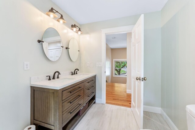 992 N Nelson Rd, Columbus, OH 43219 - bathroom with double vanity and baseboards