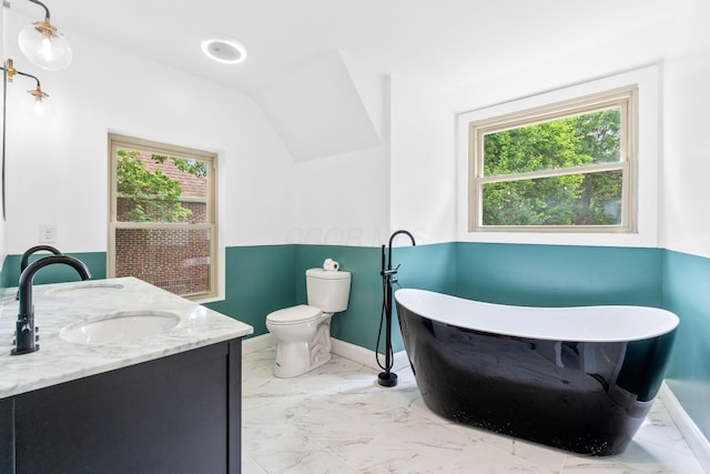 992 N Nelson Rd, Columbus, OH 43219 - full bath with marble finish floors, a soaking tub, double vanity, and vaulted ceiling