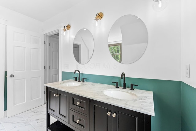 992 N Nelson Rd, Columbus, OH 43219 - full bathroom with double vanity and marble look tiles