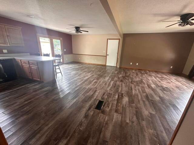 477 Greenlawn Dr, Howard, OH 43028 - kitchen with a ceiling fan, a textured ceiling, a peninsula, dark wood-type flooring, and open floor plan