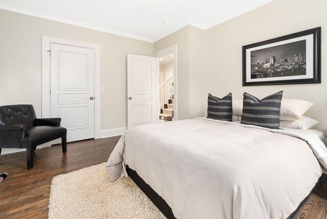 249 E Whittier St, Columbus, OH 43206 - bedroom featuring dark wood finished floors and crown molding