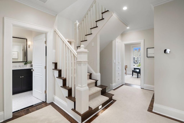 249 E Whittier St, Columbus, OH 43206 - stairway featuring ornamental molding, wood finished floors, and recessed lighting