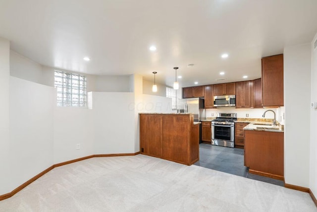 249 E Whittier St, Columbus, OH 43206 - kitchen with appliances with stainless steel finishes, brown cabinetry, dark colored carpet, recessed lighting, and a peninsula
