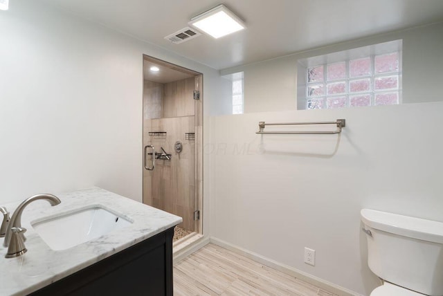 249 E Whittier St, Columbus, OH 43206 - full bathroom with a shower stall, vanity, and wood finished floors