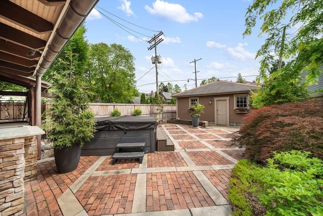 249 E Whittier St, Columbus, OH 43206 - fenced backyard featuring a hot tub, a patio, and an outdoor structure