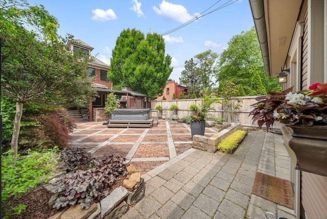 249 E Whittier St, Columbus, OH 43206 - fenced backyard with a hot tub and a patio area