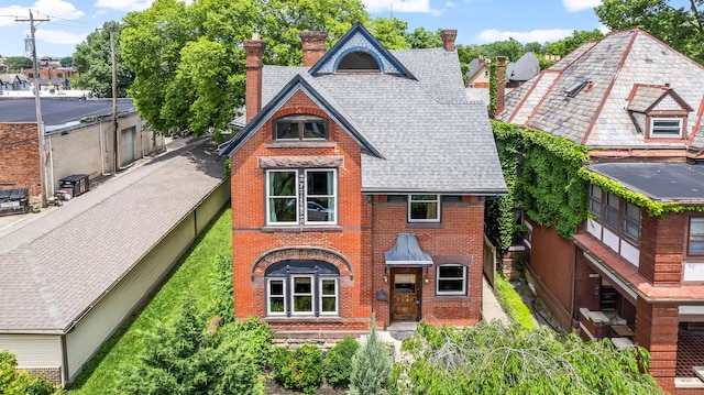 726 Franklin Ave, Columbus, OH 43205 - view of front of house featuring brick siding, a chimney, and a shingled roof