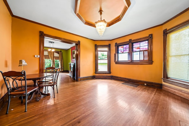 726 Franklin Ave, Columbus, OH 43205 - dining area featuring hardwood / wood-style floors, a chandelier, and ornamental molding