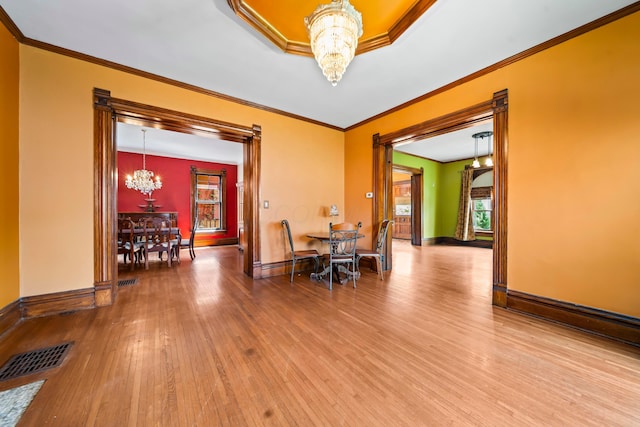 726 Franklin Ave, Columbus, OH 43205 - dining space featuring a chandelier, crown molding, and hardwood / wood-style flooring