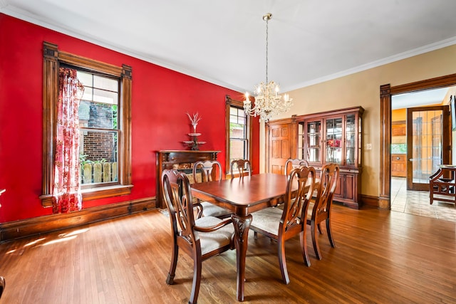 726 Franklin Ave, Columbus, OH 43205 - dining room featuring a chandelier, healthy amount of natural light, hardwood / wood-style floors, and crown molding