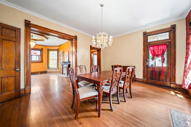726 Franklin Ave, Columbus, OH 43205 - dining room with a chandelier, light wood-style flooring, and ornamental molding