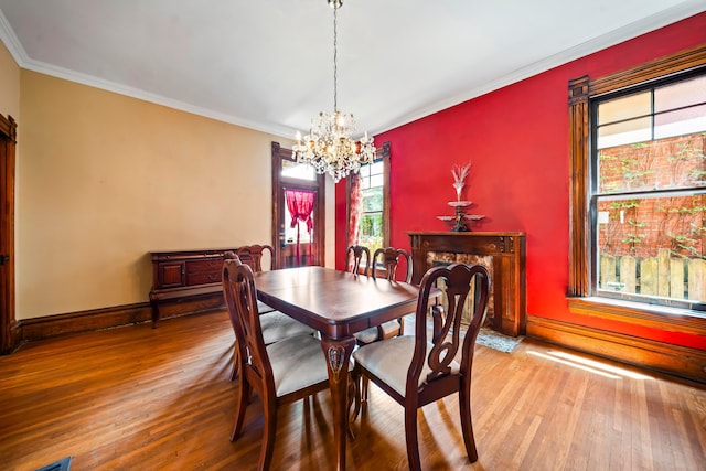 726 Franklin Ave, Columbus, OH 43205 - dining area featuring a chandelier, wood finished floors, and crown molding