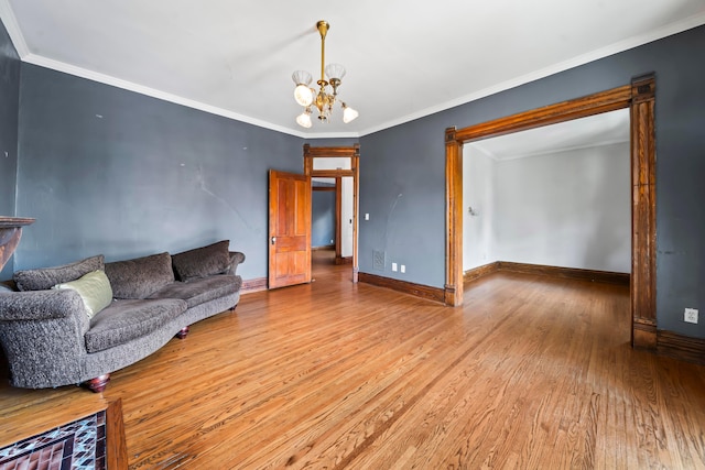 726 Franklin Ave, Columbus, OH 43205 - living room featuring light wood-type flooring, a chandelier, and ornamental molding