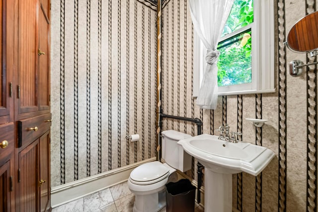 726 Franklin Ave, Columbus, OH 43205 - half bathroom featuring toilet and marble look tile flooring