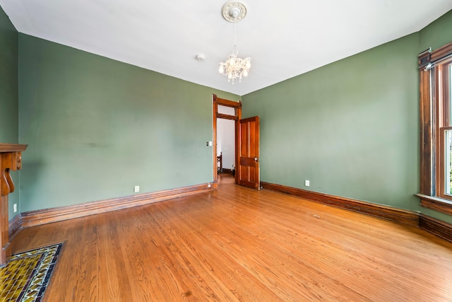 726 Franklin Ave, Columbus, OH 43205 - spare room with a chandelier, wood finished floors, plenty of natural light, and a smoke detector