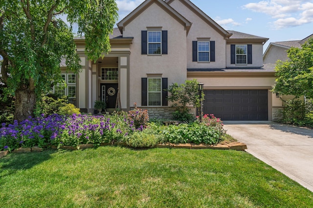 5650 Tynecastle Loop, Dublin, OH 43016 - traditional-style house with stucco siding, stone siding, concrete driveway, and a front yard