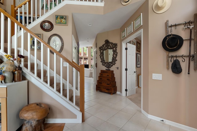 5650 Tynecastle Loop, Dublin, OH 43016 - foyer entrance featuring stairs and light tile patterned floors