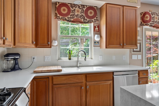 5650 Tynecastle Loop, Dublin, OH 43016 - kitchen with dishwasher, brown cabinets, black range, and light countertops