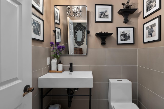 5650 Tynecastle Loop, Dublin, OH 43016 - half bath with a chandelier and tile walls