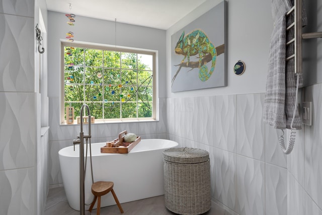 5650 Tynecastle Loop, Dublin, OH 43016 - full bathroom featuring tile walls, a freestanding bath, and wainscoting