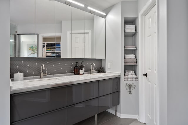 5650 Tynecastle Loop, Dublin, OH 43016 - bathroom featuring backsplash, double vanity, and a closet