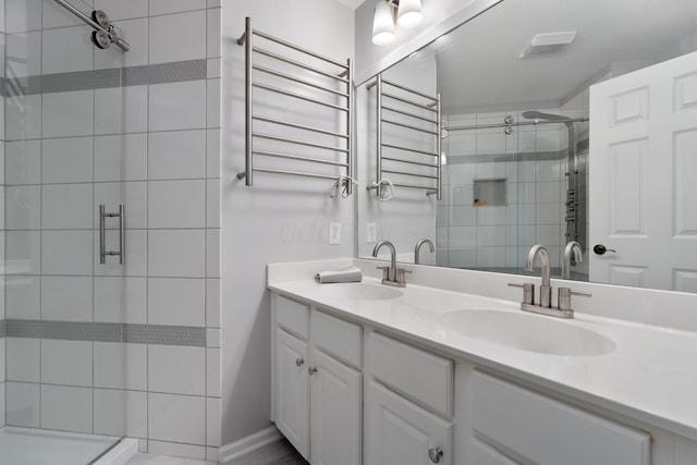 5650 Tynecastle Loop, Dublin, OH 43016 - bathroom featuring a towel warming rack, a stall shower, double vanity, and radiator heating unit