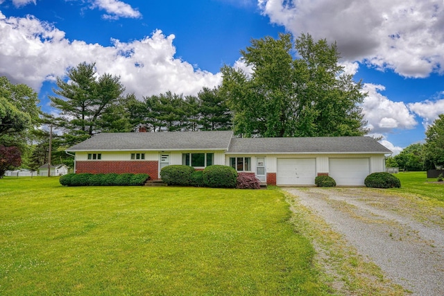 3180 Sitterley Rd NW, Canal Winchester, OH 43110 - single story home with driveway, an attached garage, a front lawn, and a chimney